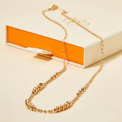 Collana di perline dorate placcato oro merci maman