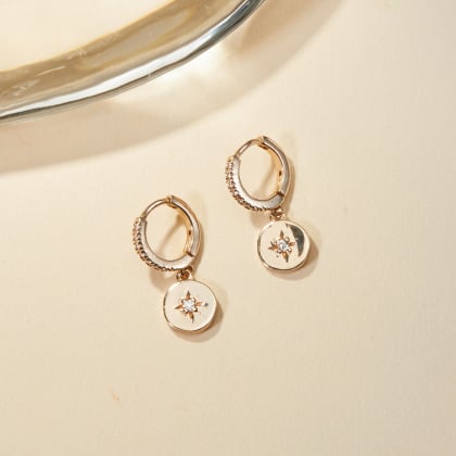 Pendientes con mini estrella de cristal baño de oro merci maman