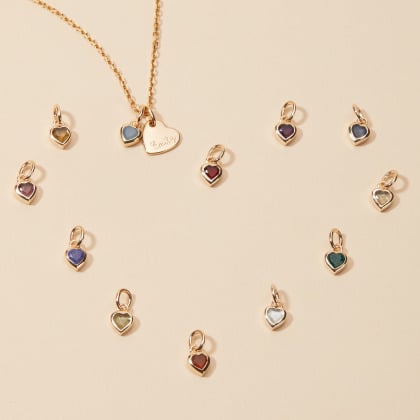 Comprar un colgante con piedra en forma de corazón baño de oro merci maman