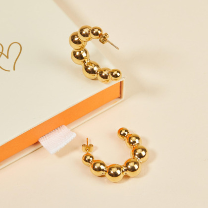 Pendientes de aro con cuentas en acero dorado merci maman