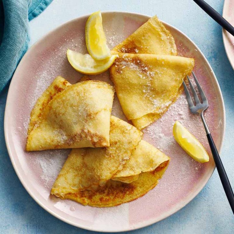 Pancake Day, super easy British pancakes with lemon wedges and sprinkled sugar